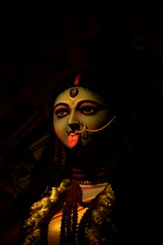 A striking statue of Goddess Kali with vivid colors and traditional adornments in Kolkata.